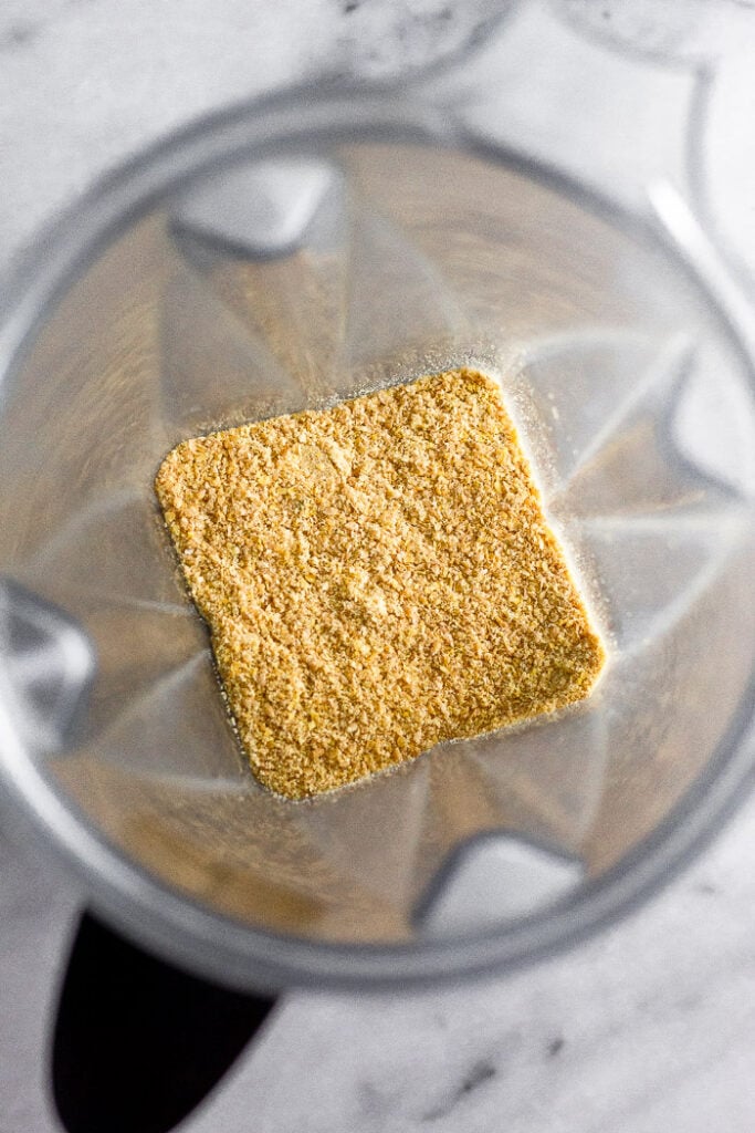 Blender filled with freshly ground flax seeds.