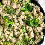 Pan filled with chicken ranch pasta with broccoli and lots of herbs.