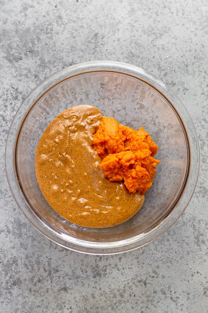 Bowl of almond butter and pumpkin puree.