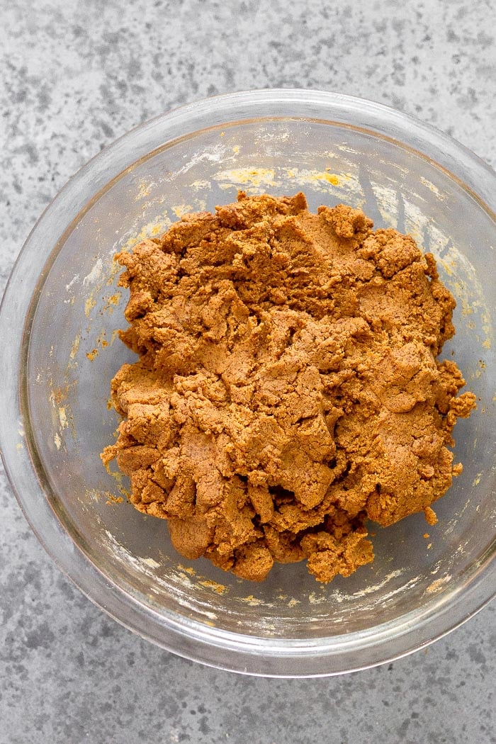 A bowl with the batter of vegan protein bars.