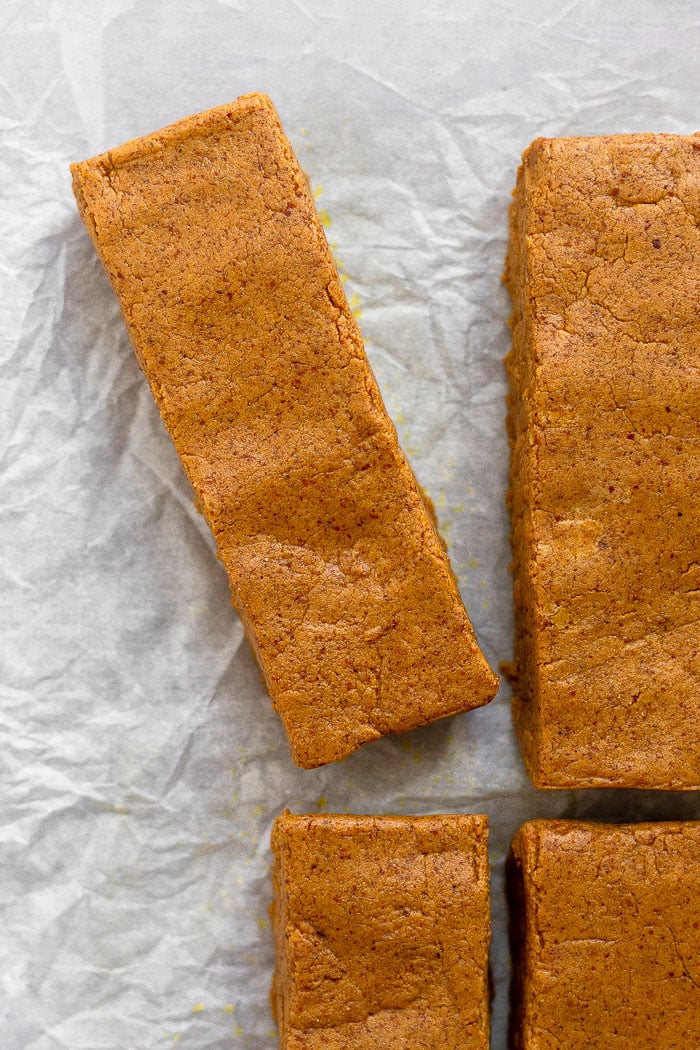 Overhead shot of pumpkin spice protein bars lined up with one slightly pulled apart from the others.