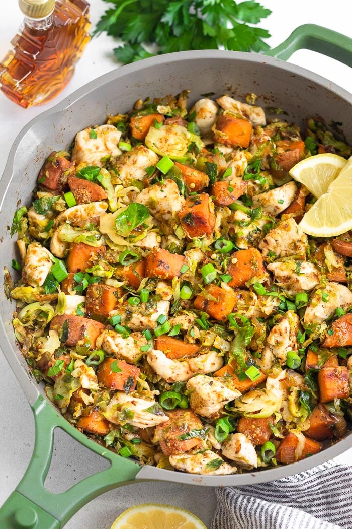 Healthy maple mustard chicken with sweet potatoes and Brussel sprouts.