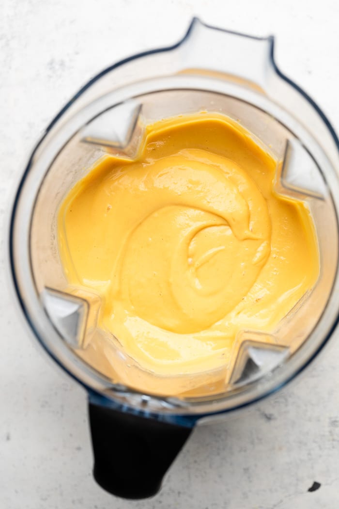 Cooked cauliflower and potatoes blended with buffalo sauce and broth in a blender.