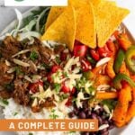 Large plate of food with meat, rice, chips, veggies, beans, and topped with cheese. There is also a screenshot of the calories and macro breakdown to learn how to count macros.