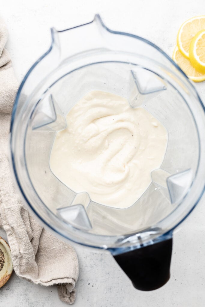 Lemon garlic cream sauce in a blender.