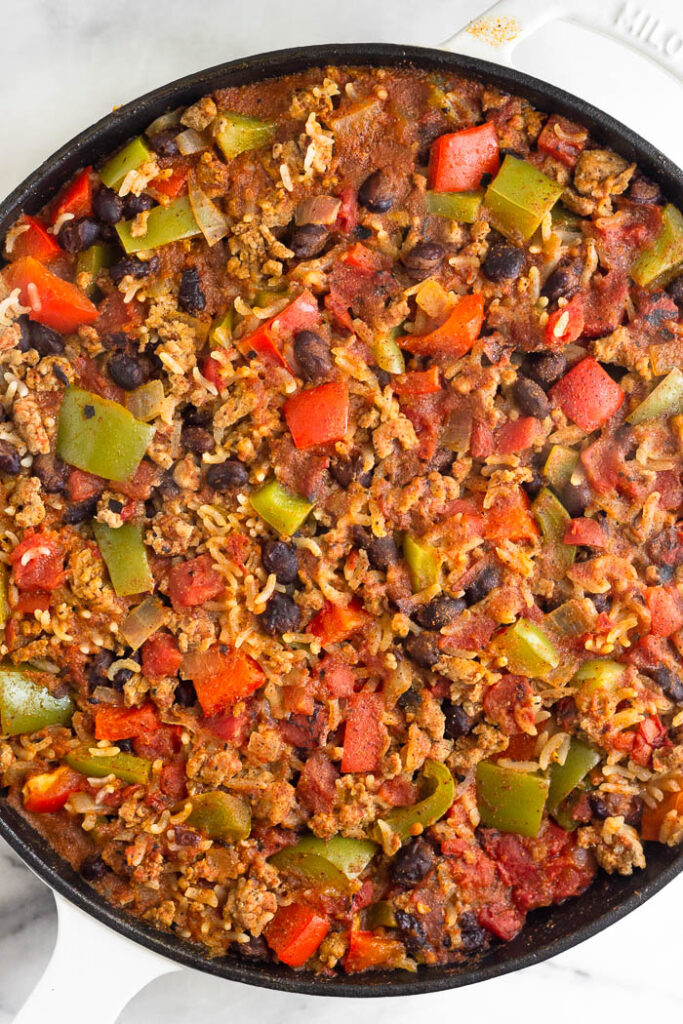 Taco skillet with rice in a large cast iron pan.