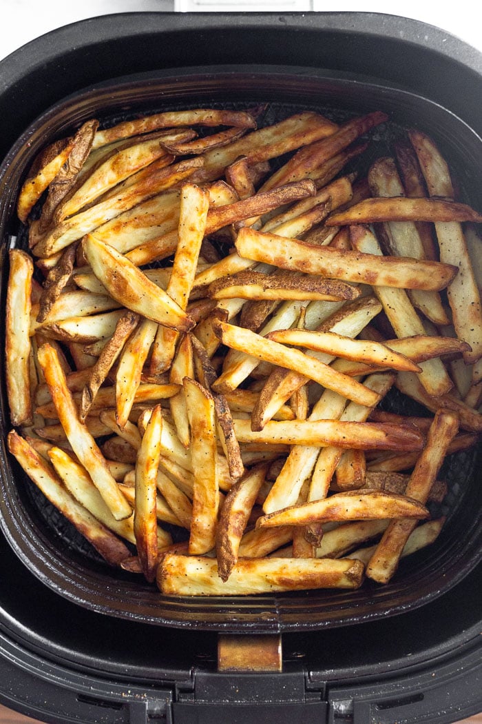 Overhead shot of homemade french fries in the air fryer.