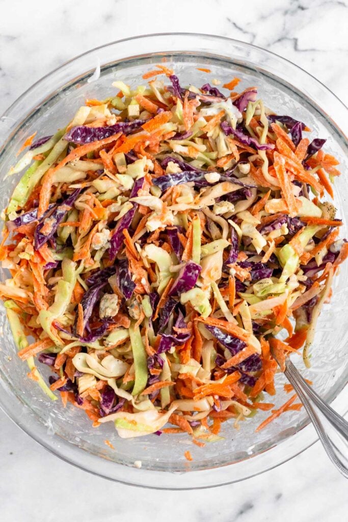Blue cheese slaw in a large glass bowl.
