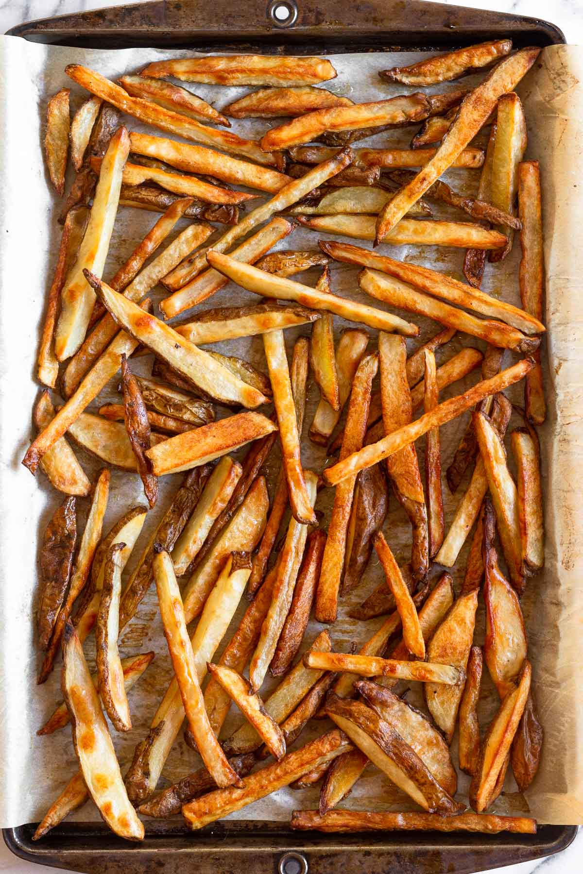 French fries on a baking sheet.
