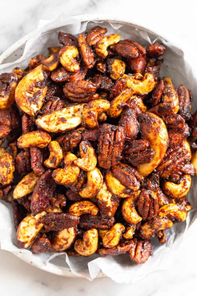 Sugared nuts in white bowl.