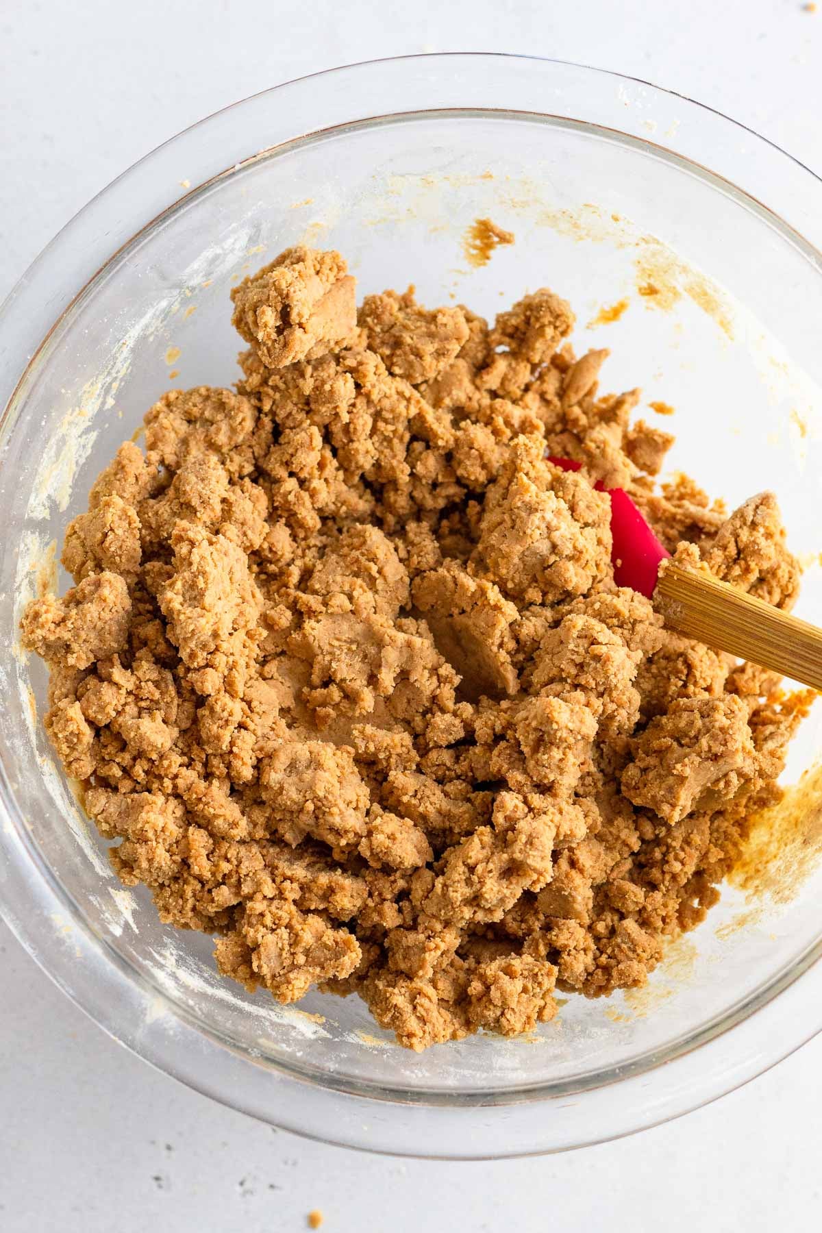 A bowl with the batter that is a little crumbly.