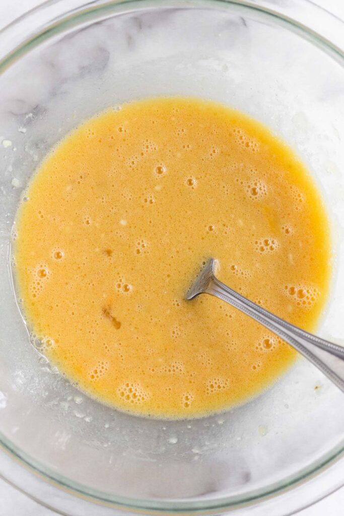 Wet batter in a bowl with a fork in it.