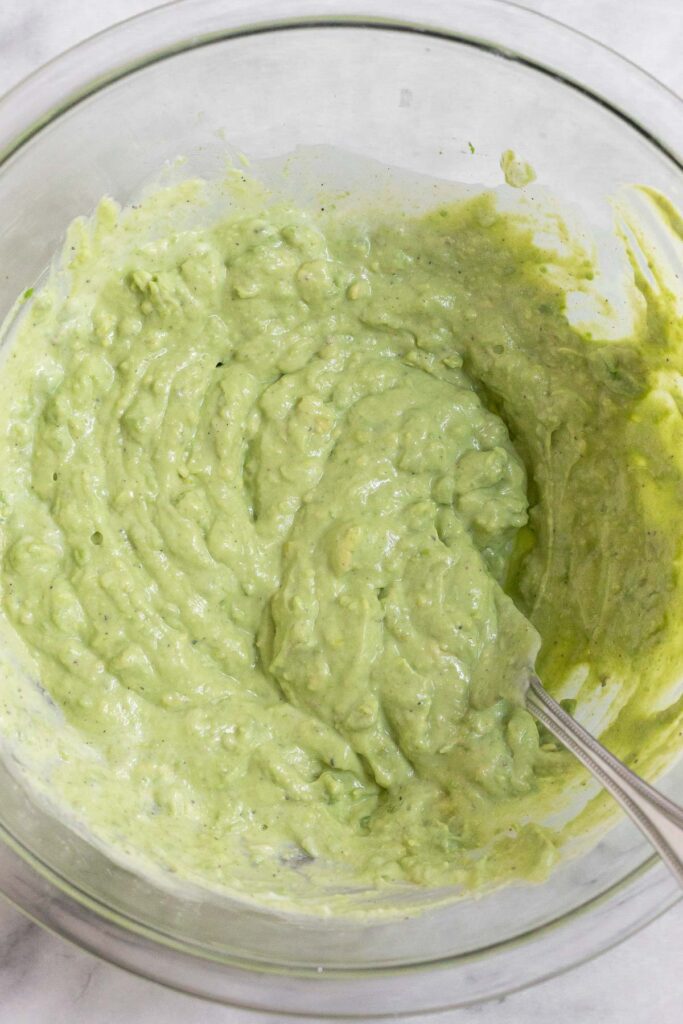 Large bowl of an avocado yogurt mixture.