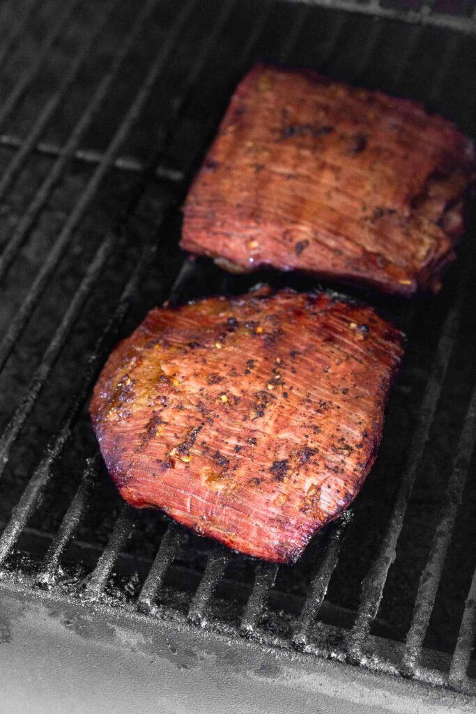 Close up of a grilled steak on the grill.