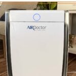 Close up of an AirDoctor air purifier in a living room.