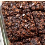 Close up of brownie baked oatmeal in a baking dish cut into squares.