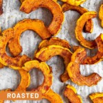 Overhead shot of cinnamon roasted delicata squash on a baking sheet.