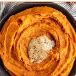 Bowl filled with whipped sweet potatoes topped with tahini and cinnamon.
