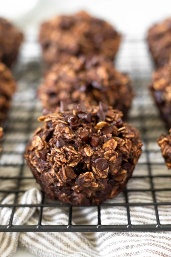 Oatmeal chocolate muffins on a cooling rack.
