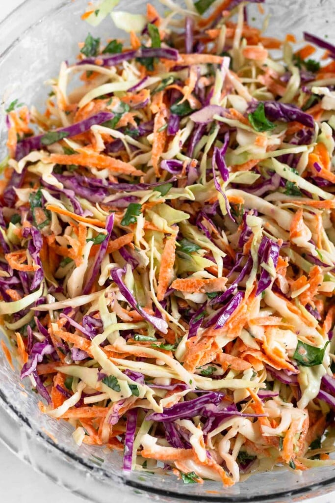 Glass bowl filled with healthy coleslaw.