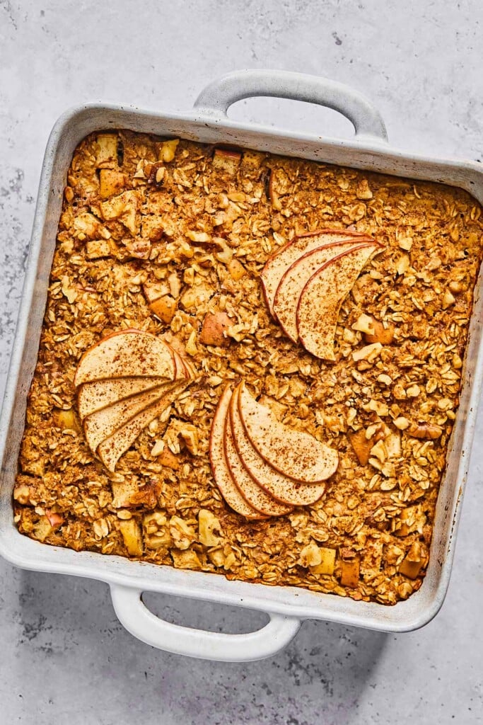 Overhead shot of apple oatmeal bake in a large white baking dish.